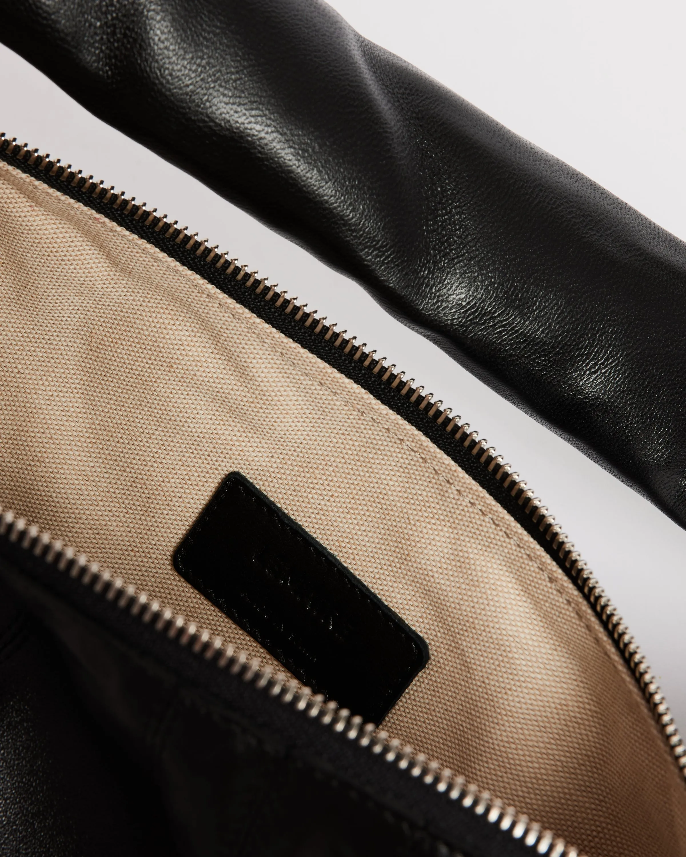 Small Croissant Leather Bag in Black